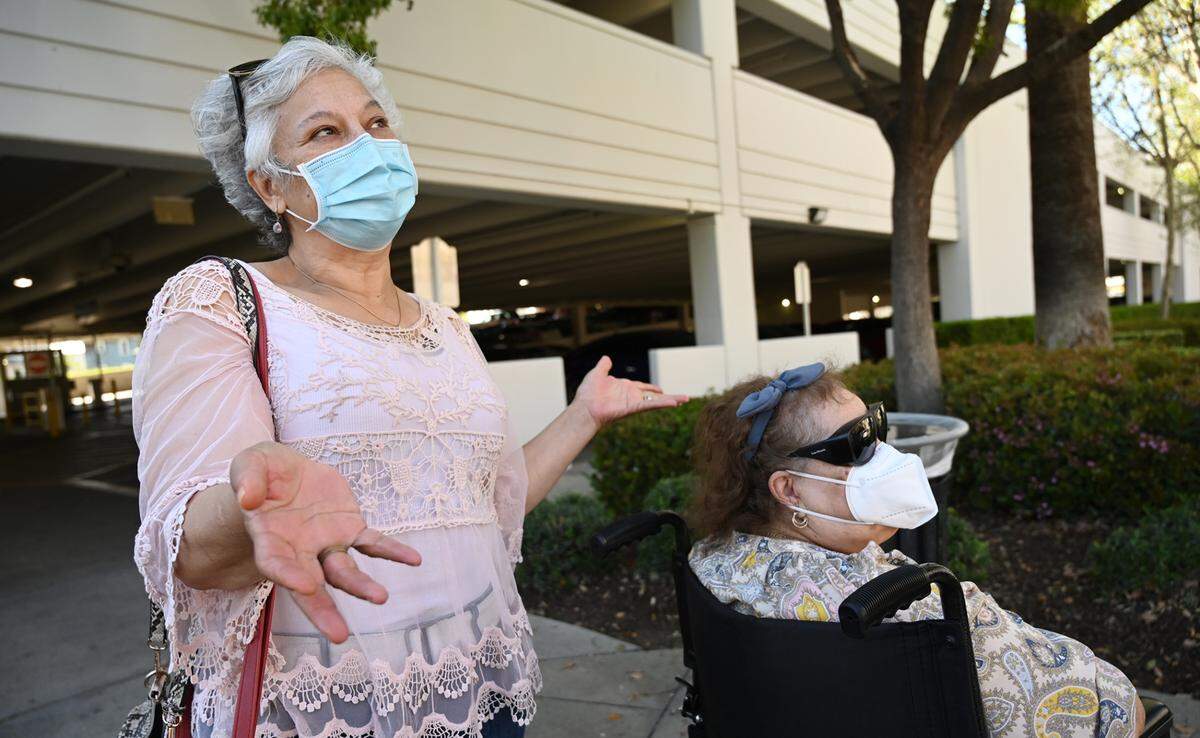 Lorena Espinoza, left, with her mother Carlota Espinoza to the right, says her main concern with Community Regional Medical Center is lack of health care options for the underinsured if Clovis Community is the only option.