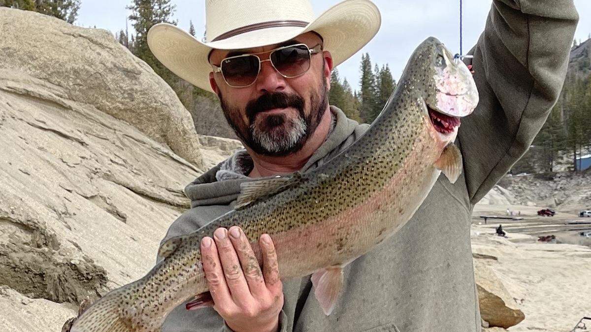 Ben Farris of Clovis shows off his 26-inch, 7-pound rainbow trout caught off the bank at Shaver Lake on Feb. 5 on rainbow Power Bait.