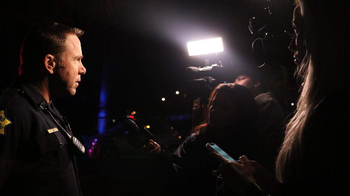 Lt. Steve Card speaks with reporters at the scene of a shooting in front of an apartment complex in southeast Fresno on Sunday, Nov. 4, 2018