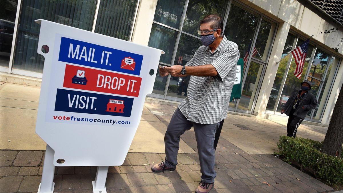 Reedley resident James Soto drove all the way into downtown Fresno to drop his ballot off at the Fresno County Elections Office ballot box, Tuesday Oct. 6, 2020.