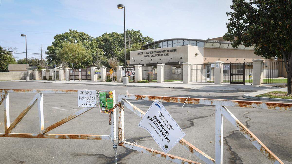 The parking lot at the Maxie L. Parks Community Center in west Fresno is gated shut on Friday, Oct. 9, 2020. The West Fresno Family Resource Center had to move their operations to the Mary Ella Brown Community Center weeks ago after being told the Maxie Parks building was contaminated with chemicals.