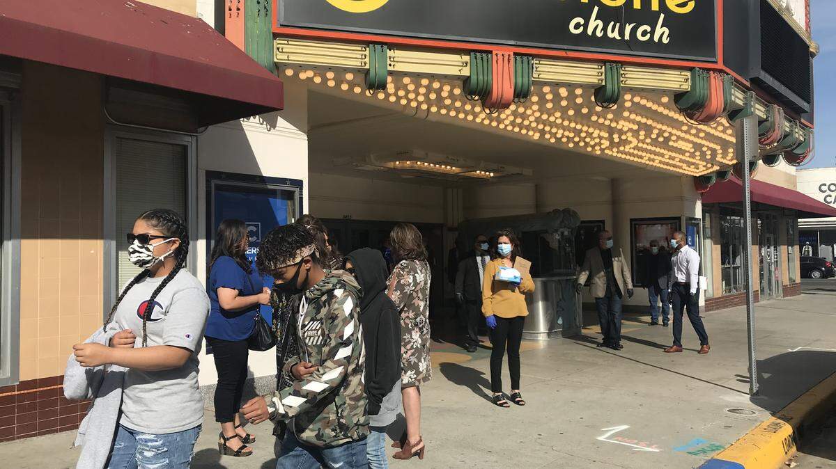 Church goers arrive at Cornerstone Church in downtown Fresno wearing masks. The church defied state and county guidelines by meeting indoors. Fresno City Council member Mike Karbassi says Gov. Newsom should allow churches to meet if they take necessary precautions due to COVID-19.