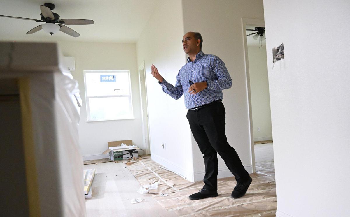 Alex Salazar of The Salazar Group describes the features of a detached ADU unit on a property Friday, Feb. 28, 2025 in Madera.