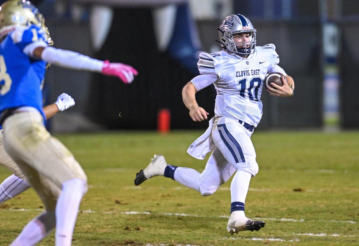 Clovis East quarterback Tyus Miller sprints for the sideline on a keeper during their game against Clovis at Lamonica Stadium on Friday, Oct. 18, 2024.