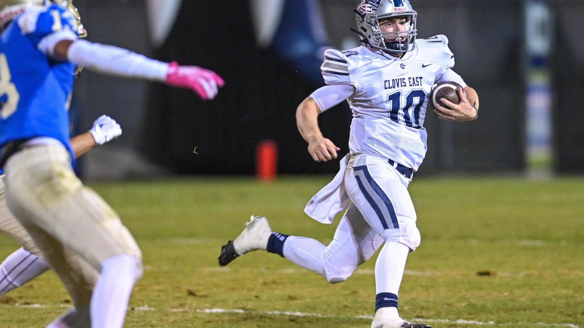 Clovis East quarterback Tyus Miller sprints for the sideline on a keeper during their game against Clovis at Lamonica Stadium on Friday, Oct. 18, 2024.