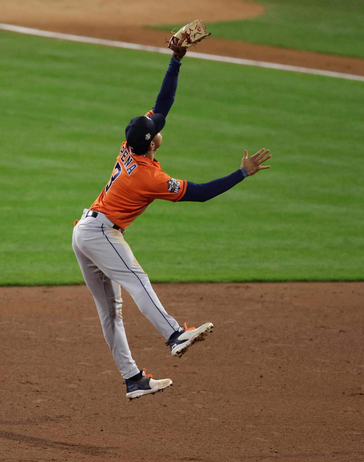 Houston Astros shortstop Jeremy Peña makes a leaping grab for an out on a line drive off the bat of Philadelphia Phillies batter Nick Castellanos in the bottom of the third inning of game five of the World Series at Citizens Bank Park in Philadelphia.