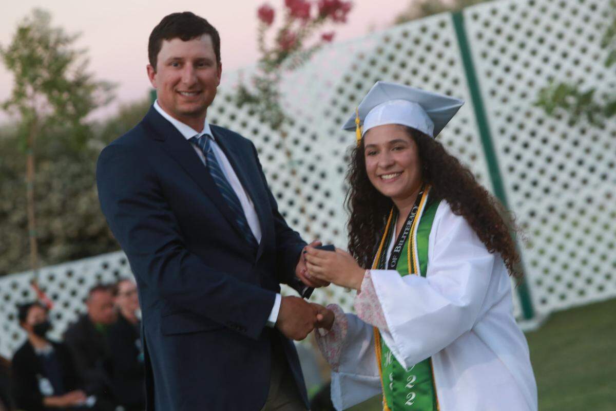Riverdale High School valedictorian Isabela González, gets an academic achievement award during the graduation ceremony on June 10. 