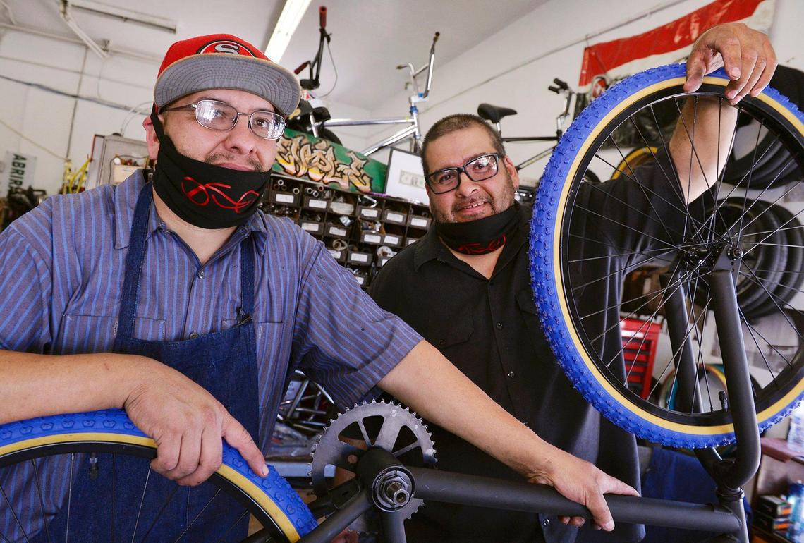 David De La Torre, left, with his brother Jimmy De La Torre to the right, has opened a bike shop, Dave Street Customs Bike Shop, located on E Street near Chinatown. Dave, whose shop focuses on used bikes, said the COVID19 pandemic has increased business. Photographed Wednesday, May 27, 2020 in Fresno.