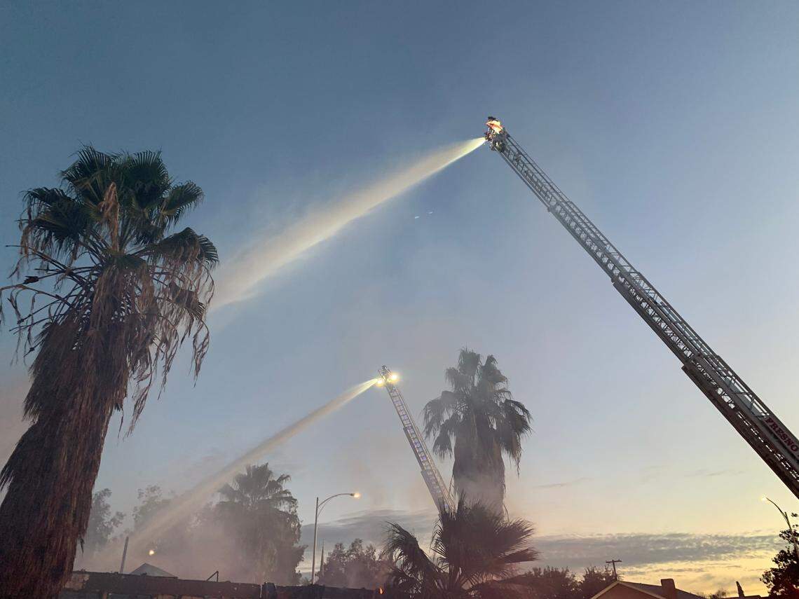 Fire crews battle a fire at a vacant building in southeast Fresno early Tuesday morning.