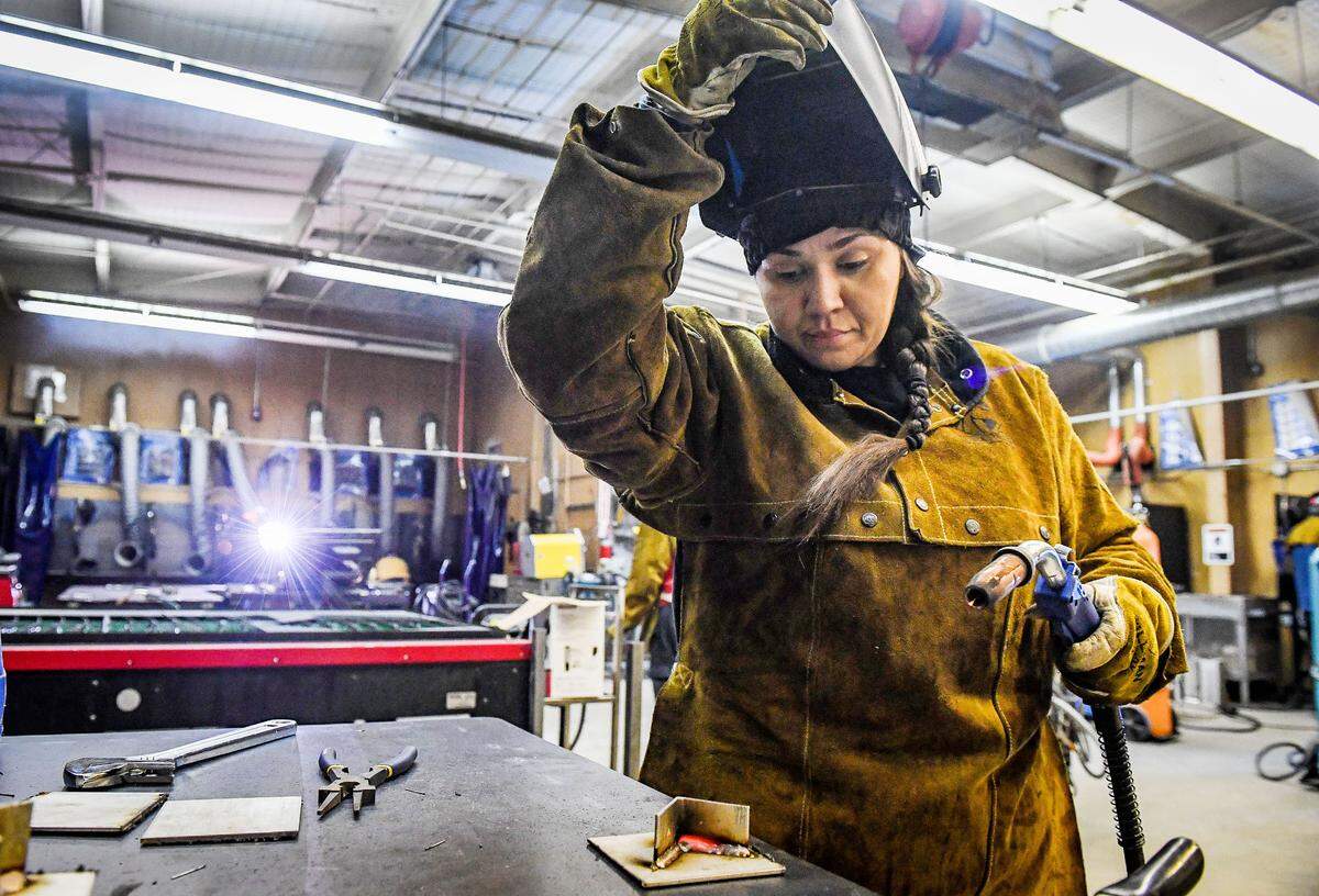 Kimberley Barragan checks her work while practicing her welding skills in the Gladiator Welding Program held at Washington Union High School on Monday, Dec. 6, 2021.