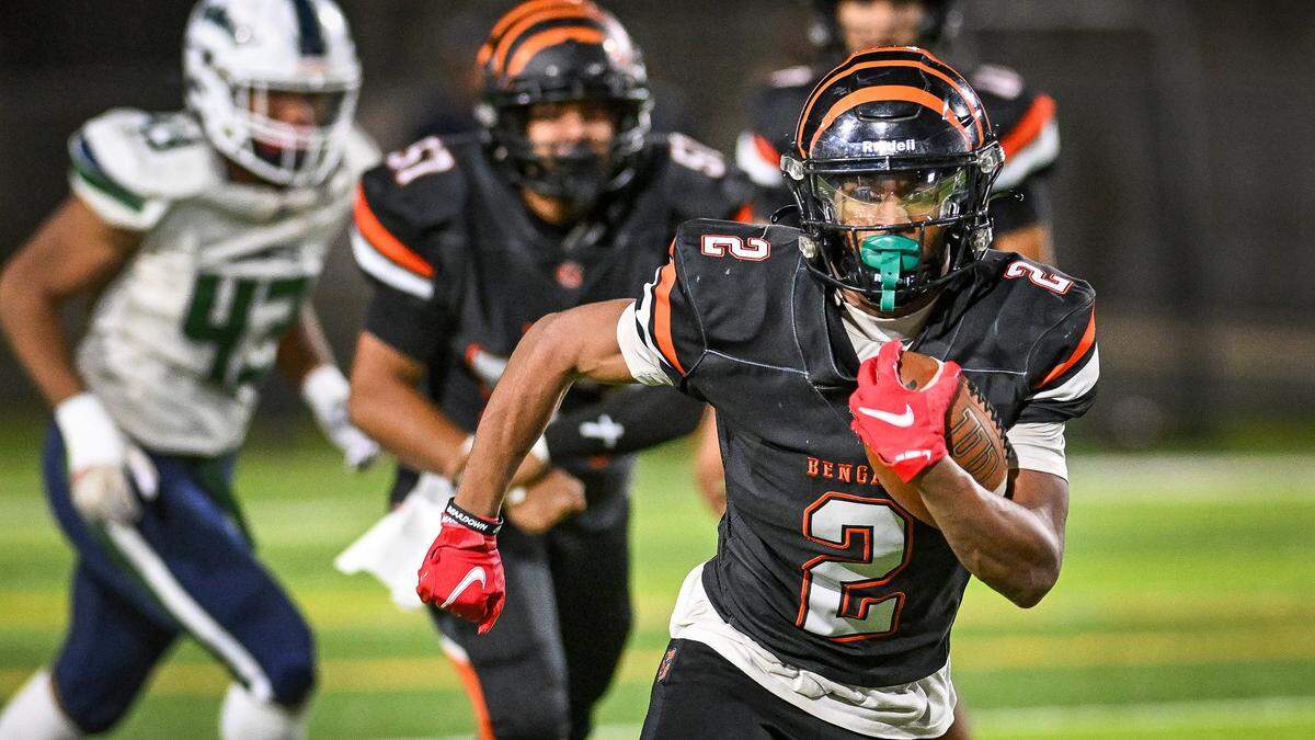 Central East's Brandon Smith finds room in the backfield on a run against Clovis East during their playoff game at Deran Koligian Stadium in Fresno on Friday, Nov. 7, 2025.