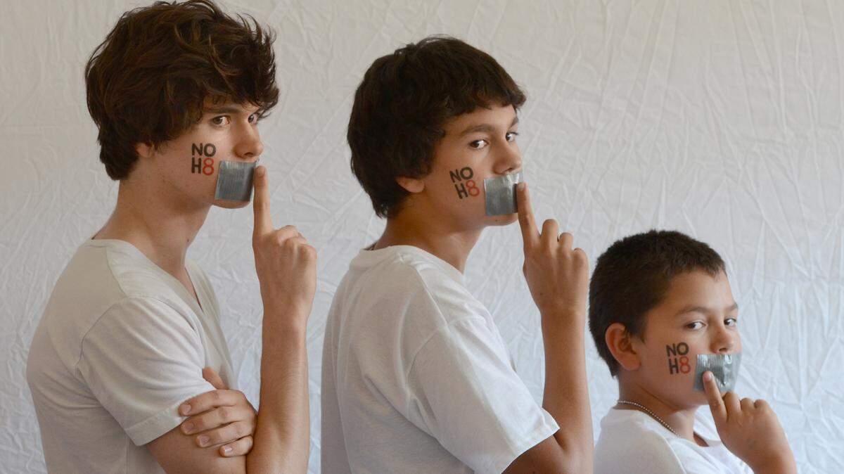 MARK CROSSE/THE FRESNO BEE In a file photo from 2012, a 16-year old, 14-year old and 11-year old participated in the NOH8 photographic campaign that came to Fresno. The NOH8 campaign photo shoot is returning to Fresno on Sunday, held from 2 p.m.-4 p.m. at the Hampton Inn Fresno Airport. For $40, people can have their photo taken with a NOH8 temporary tattoo on their face and mouths duct taped shut. The taped mouths symbolizes voices being silenced by the legislation. The project started in 2008 when Prop 8 first passed thereby banning same-sex marriage. Money raised for the non-profit will be used to promote and raise awareness for marriage equality.