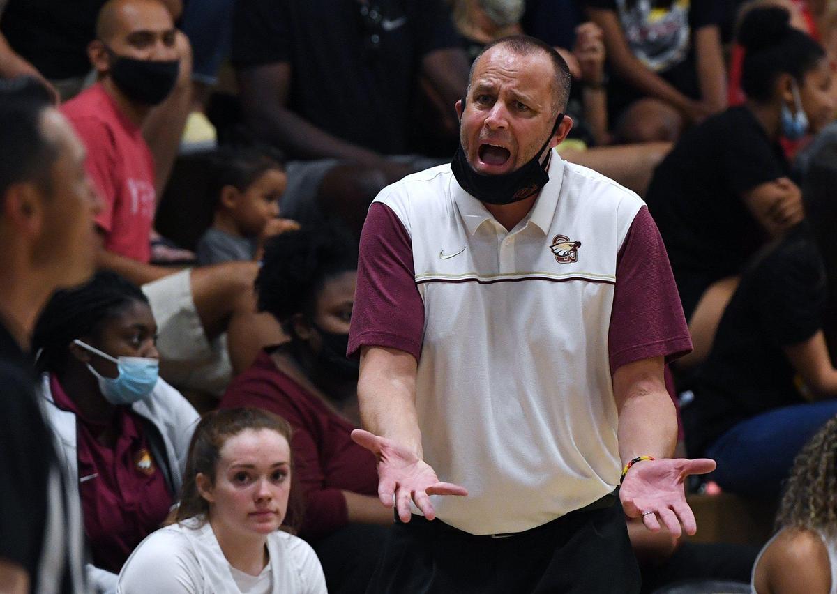 Clovis West head coach Craig Campbell argues with an official in the game against Clovis High for the Central Section Open Division girls basketball championship Thursday, June 10, 2021 in Fresno.