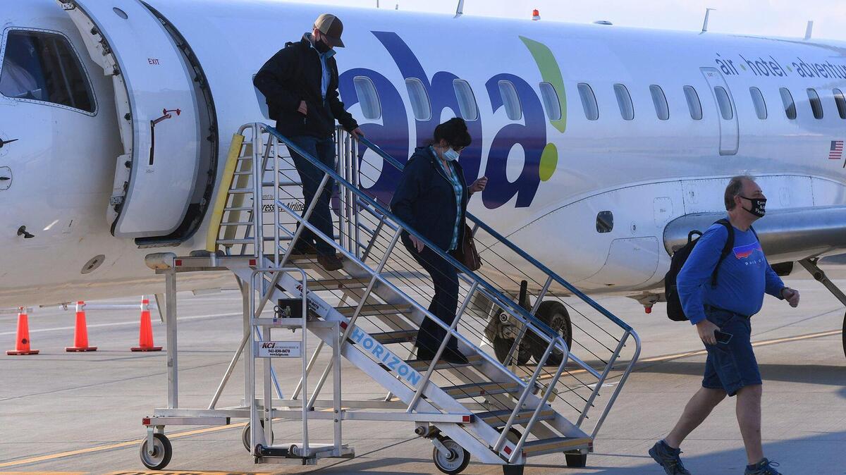 The first eight passengers for the inaugural flight to Fresno from Reno of Aha! Air disembark at Fresno Yosemite International Airport Wednesday, Nov. 10, 2021 in Fresno. aha! Airlines ceased all of its flight operations in the western U.S. on Aug. 23, 2022 as it filed for bankruptcy protection.