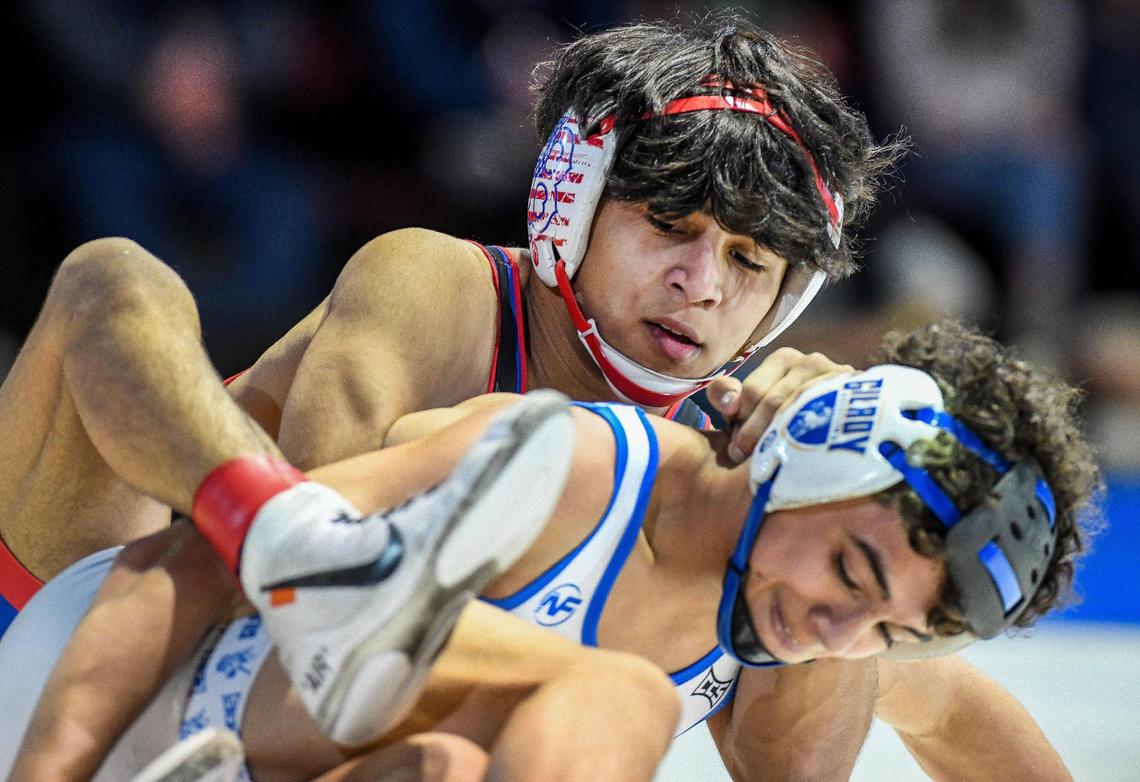 Buchanan’s Joseph Toscano, top, wrestles Elijah Cortez of Gilroy in the boys 126-pound CIF State Wrestling Championship match at Mechanics Bank Arena in Bakersfield on Saturday, Feb. 25, 2023. Toscano lost the bout and finished second overall.