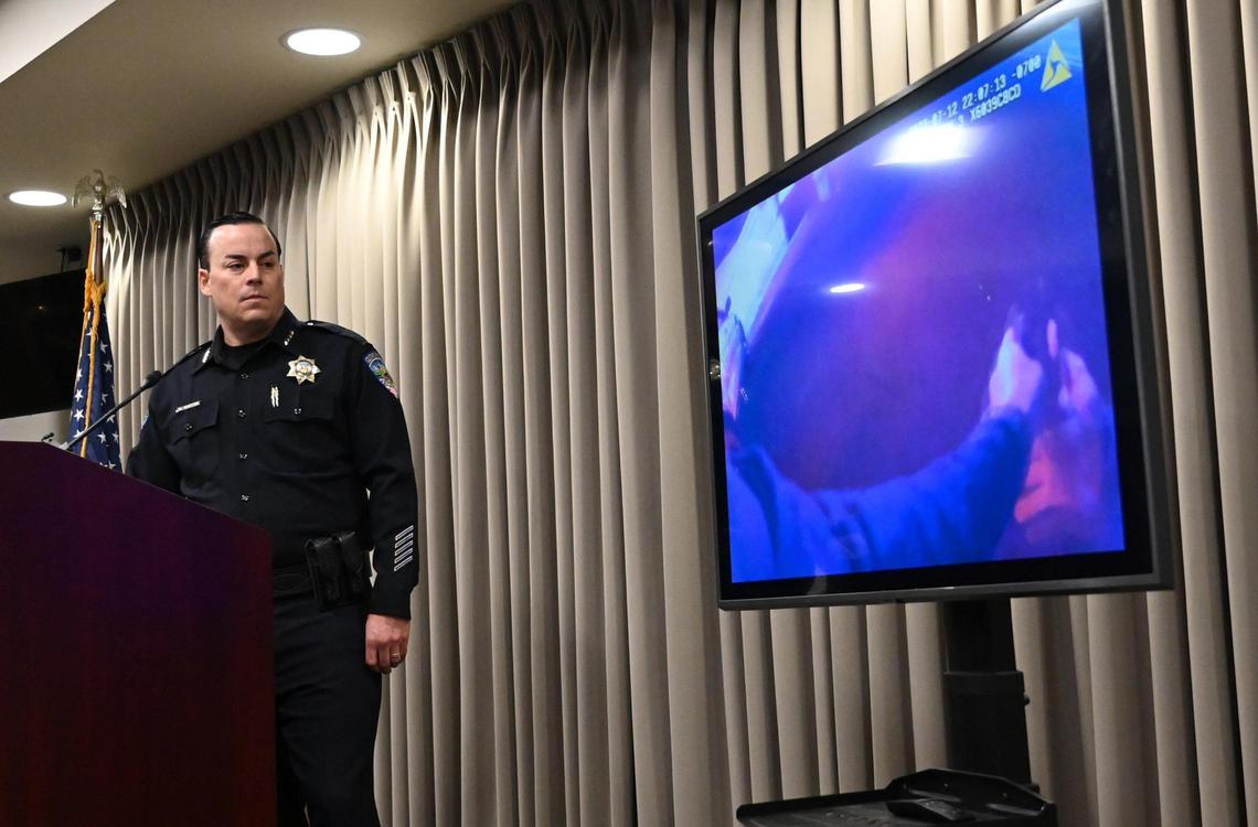 Clovis Chief of Police Curt Fleming shows an officer’s gun drawn in body camera footage as he announces the latest about the July 12 OIS during a press conference Tuesday, July 19, 2022.