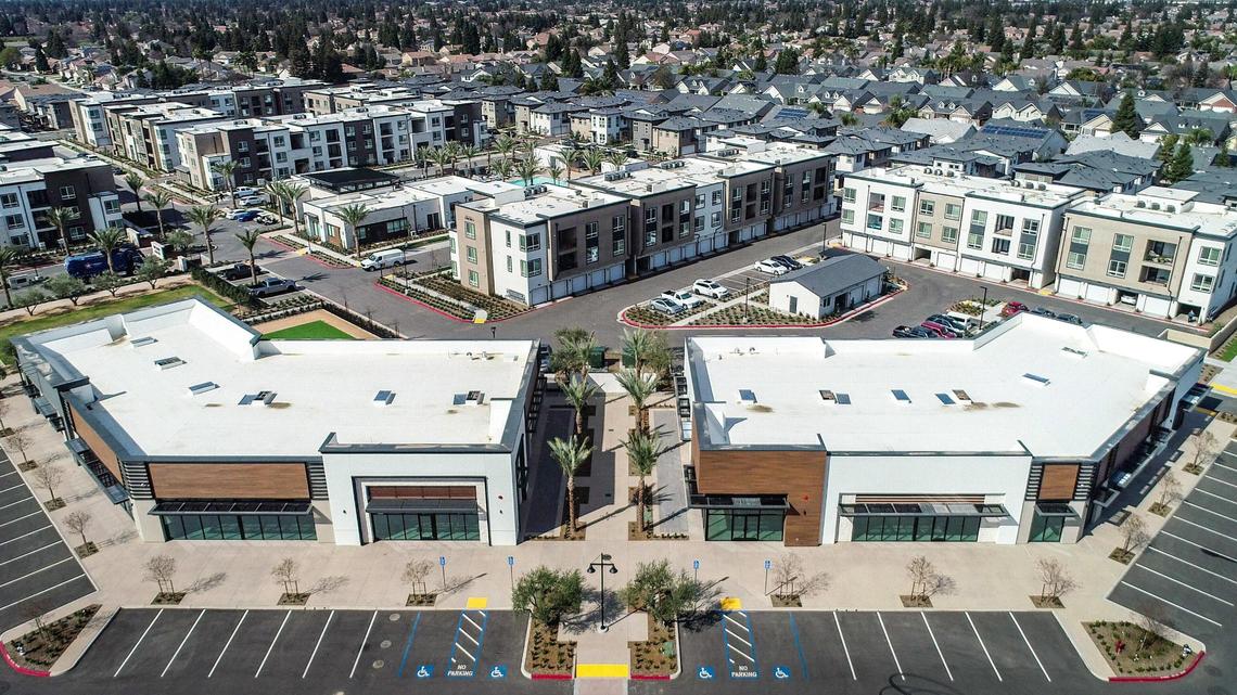 Commercial building space for lease, foreground, is part of the overall community plan for The Row at Heritage Grove featuring high-end apartment living, background, on the border of northeast Fresno and Clovis. Vincent Ricchiuti, a fourth-generation farmer, has taken on an added responsibility as developer for his family’s ag land in the future grown area of Heritage Grove.