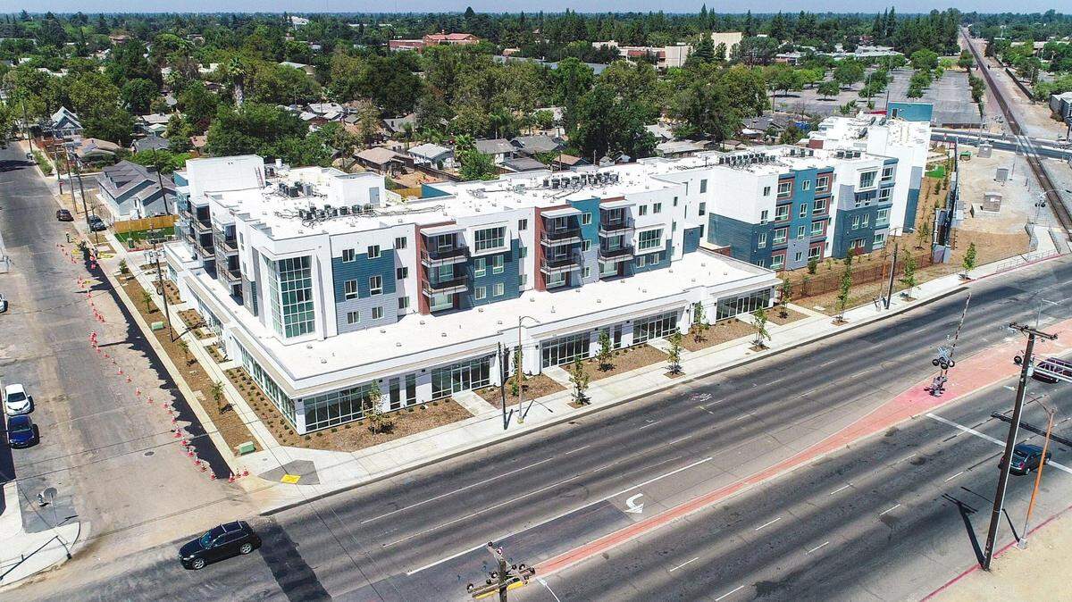 A drone image shows the front of an 88-unit affordable apartment complex - known as The Link. Fresno renters need to earn on average $21 per hour or 1.5 times the minimum wage for a full-time employee in order to afford $1,137, the fair market price for a two-bedroom apartment.