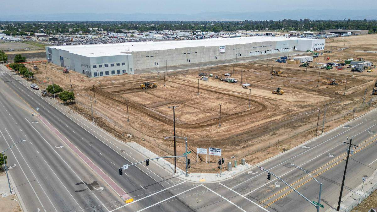A giant warehouse is shown under construction on the northeast corner of Marks and Nielsen in west Fresno. The project, which was proposed more than five years ago, will result in three warehouse buildings totaling more than 800,000 square feet.