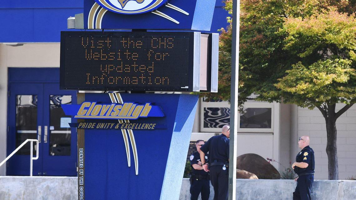 Clovis Police officers stand on the Clovis High campus Tuesday afternoon, Sept. 20, 2022 in Clovis.