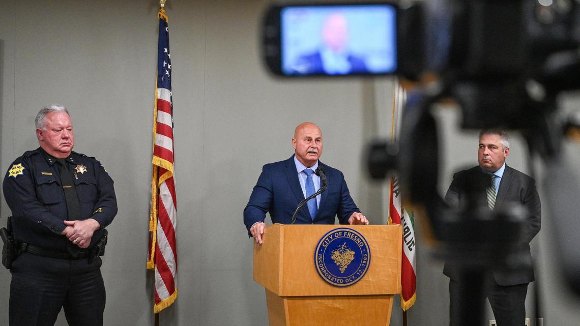 Fresno Mayor Jerry Dyer, center, is joined by Fresno deputy police chief Burke Farrah, left, and Travis Stokes of the Fresno city attorney’s office, while holding a news conference to detail a phishing scam that the city was a victim to, at Fresno City Hall on Thursday, March 10, 2022.