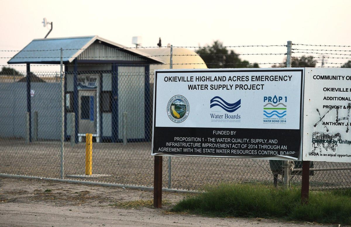 Okieville’s water well and pump, with a dispenser for community members to use plastic jugs, shown Friday, Aug. 13, 2021 in Tulare County’s Okieville.