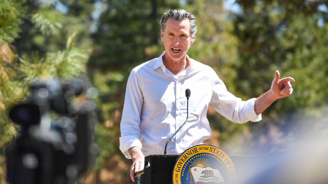 California Governor Gavin Newsom gives a press conference after touring an area burned by last year’s Creek Fire near Shaver Lake in April. New polling shows voters are nearly split on whether or not to recall the first-term Democrat.