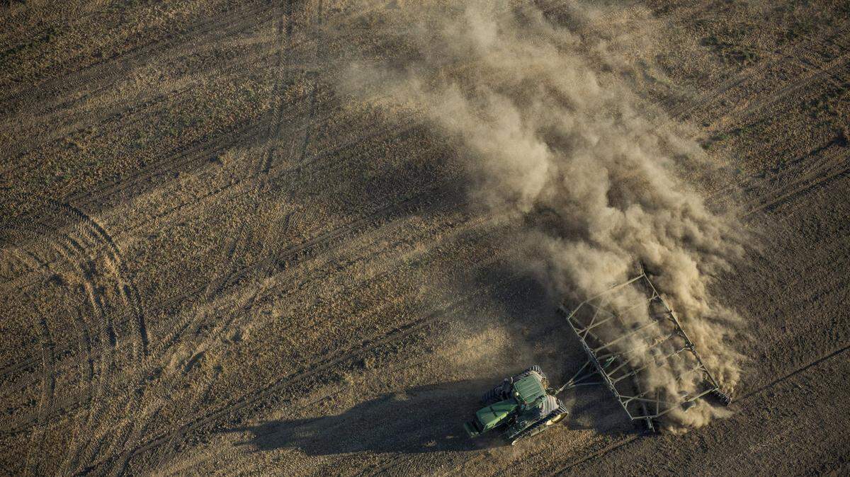 A tractor plows a dusty field in the Westlands Water District west of Fresno.