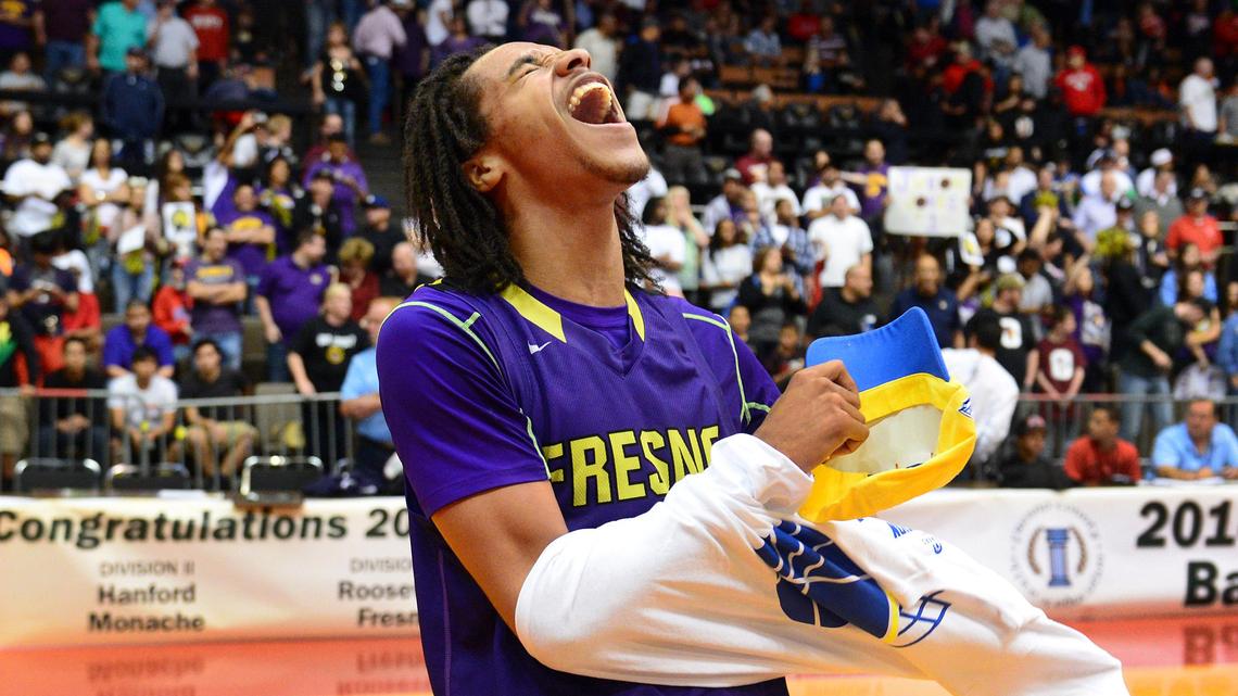 Fresno’s Daryl Edwards celebrates after the Warriors beat Roosevelt for the boys Division III Central Section championship at Selland Arena Saturday, March 8, 2014.