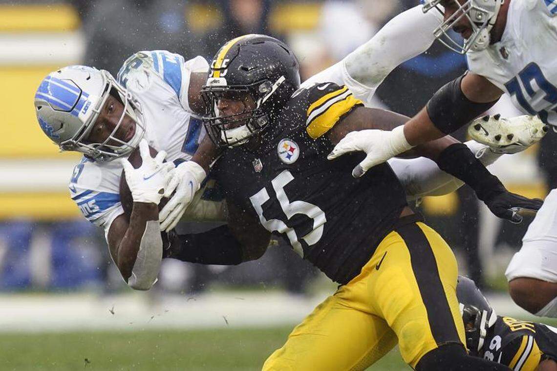 Pittsburgh Steelers inside linebacker Devin Bush tackles Detroit Lions running back Godwin Igwebuike during the second half of an NFL game, Sunday, Nov. 14, 2021, in Pittsburgh.