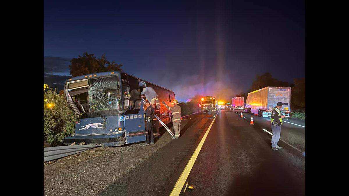 Tulare firefighters help riders off of a Greyhound bus that crashed on Highway 99 south of Highway 137 on Wednesday, Nov. 9, 2022, according to the California Highway Patrol.