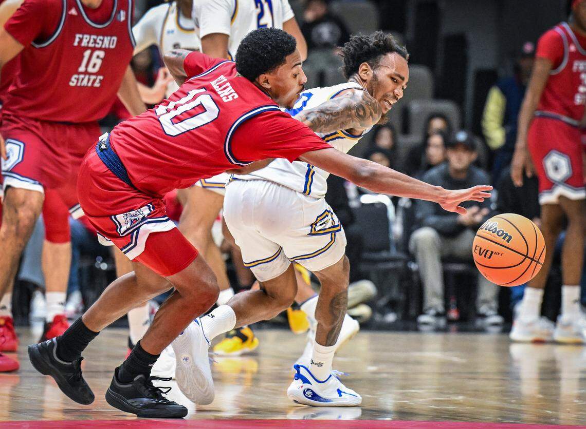 Fresno State's Zaon Collins, left, steals the ball away from CSU Bakersfield's CJ Hardy during their non-conference game at Selland Arena in downtown Fresno for the “Return to Selland” game on Sunday, Nov. 30, 2025.