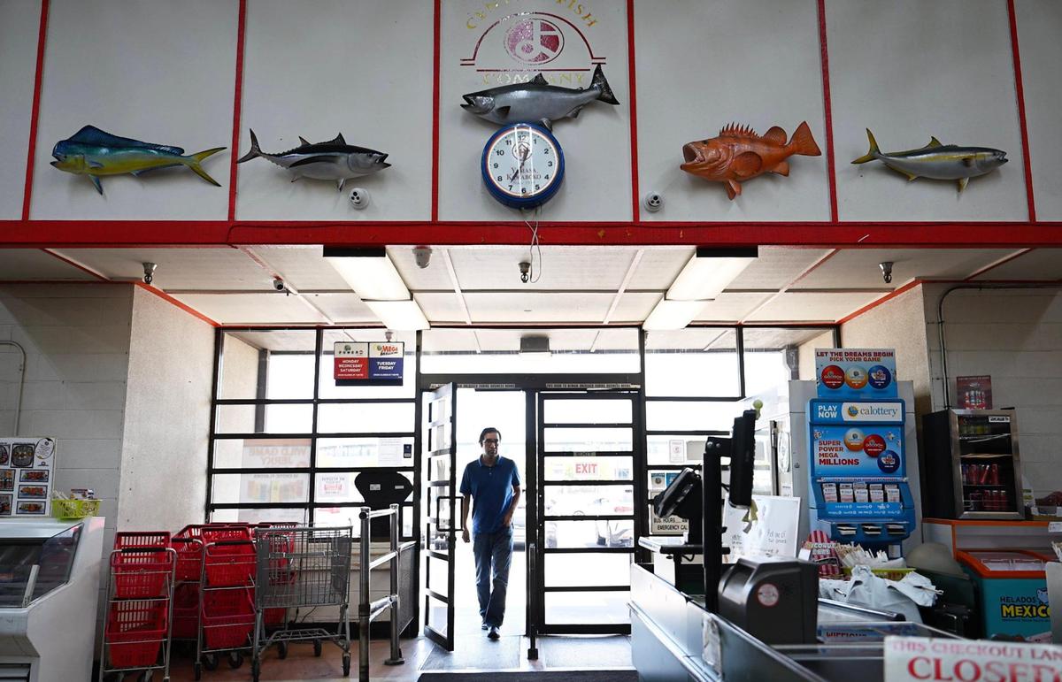 A cusrtomer walks into Central Fish located in Chinatown Tuesday, April 29, 2025 in Fresno.