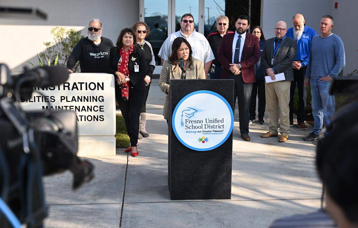 Fresno Unified Superintendent Misty Her, center, leads an announcment that a temporary solution has been reached regarding a disruption of health insurance for retirees between Community Medical Centers and Aetna during a press conference held Thursday, Jan. 15, 2026 in Fresno.