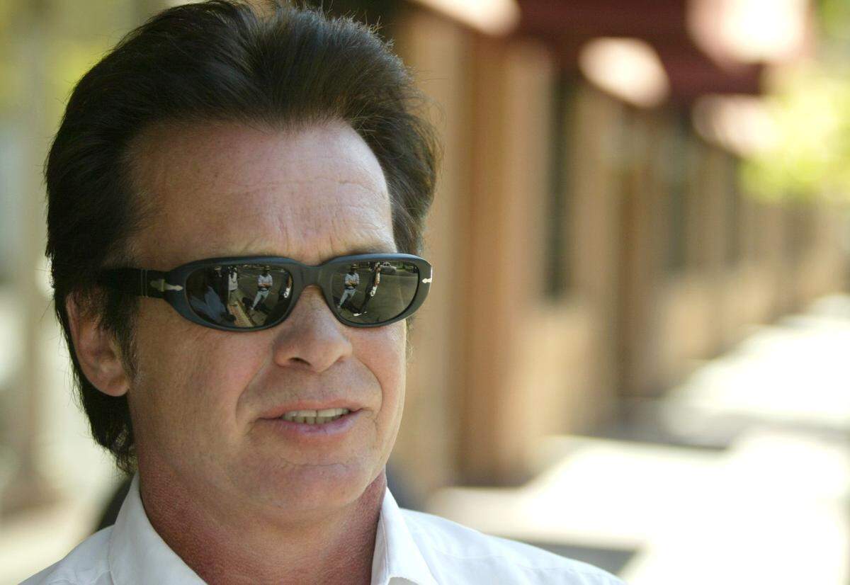 John Mellencamp leaves Superior Dairy in Hanford, California, in September 2004 before heading to film a music video production.