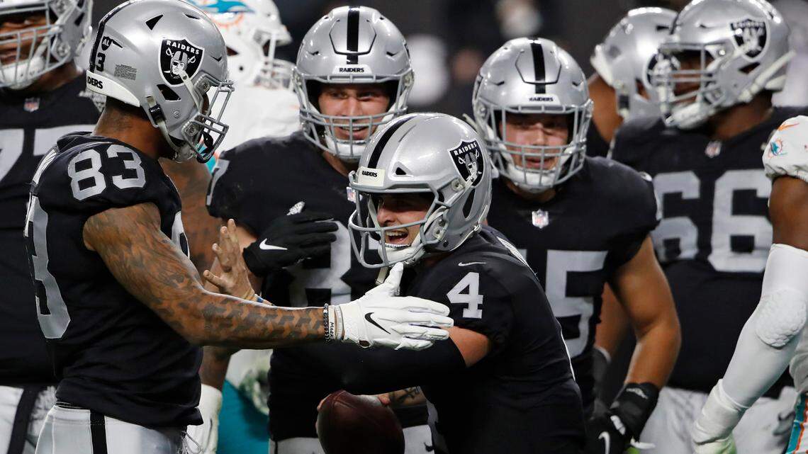 Las Vegas Raiders quarterback Derek Carr (4) celebrates after scoring a touchdown against the Miami Dolphins during the first half of an NFL football game, Saturday, Dec. 26, 2020, in Las Vegas. (AP Photo/Steve Marcus)