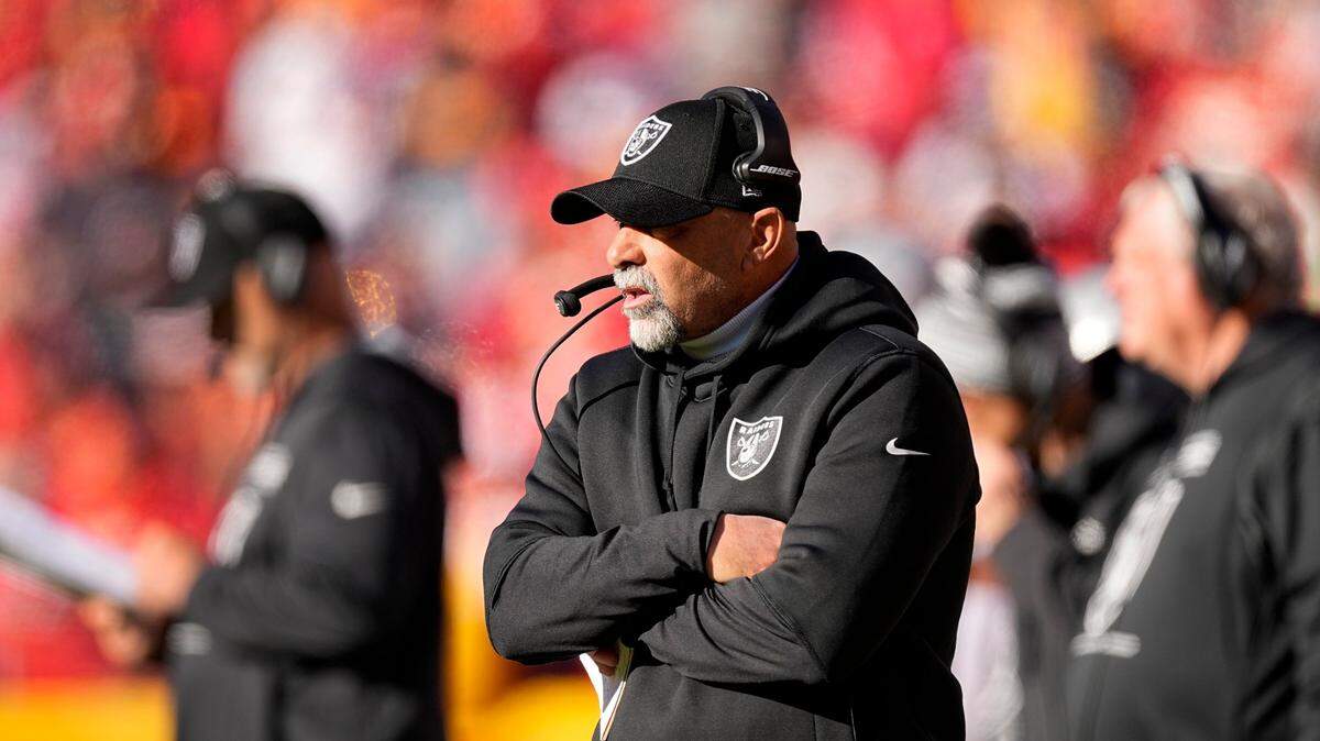 Las Vegas Raiders interim head coach Rich Bisaccia watches from the sidelines during the first half of an NFL game against the Kansas City Chiefs Sunday, Dec. 12, 2021, in Kansas City, Mo.