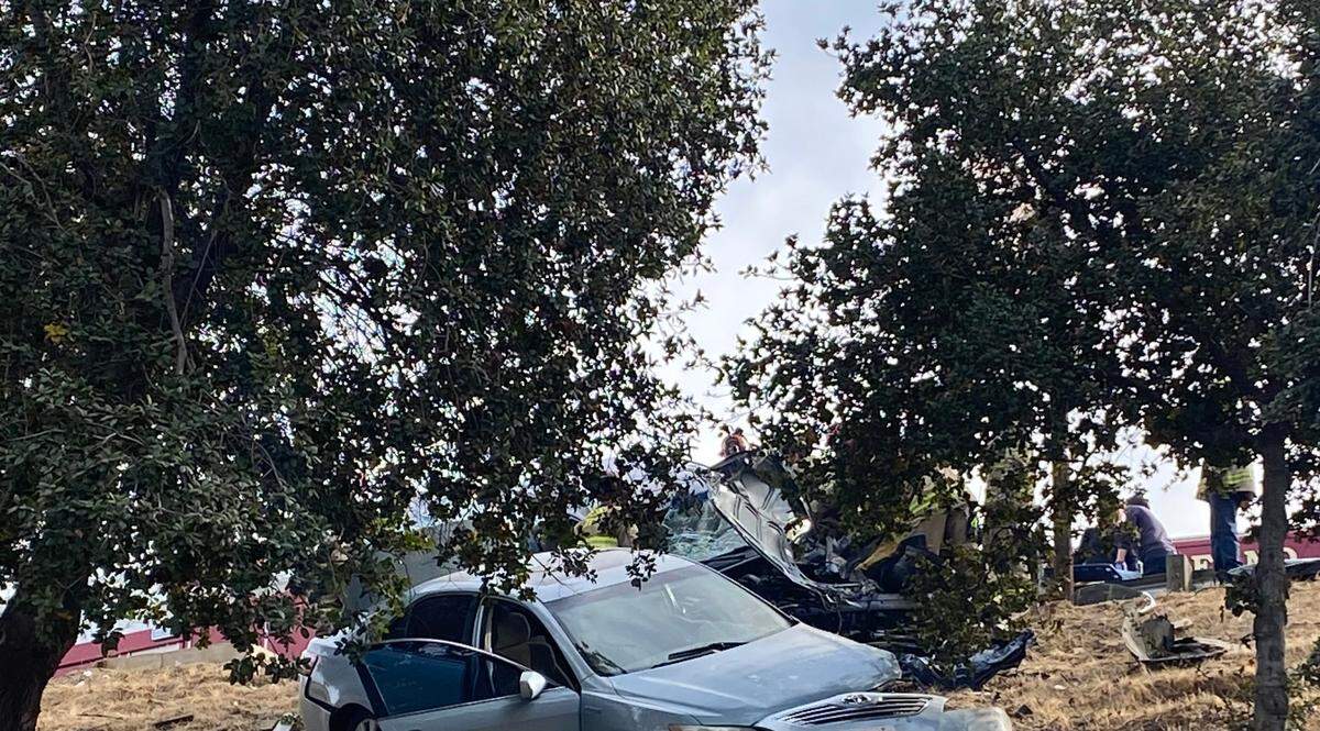 Fire crews removed a man from a vehicle following a two-car collision on a Fresno, California highway on Sunday, Dec. 17, 2023.