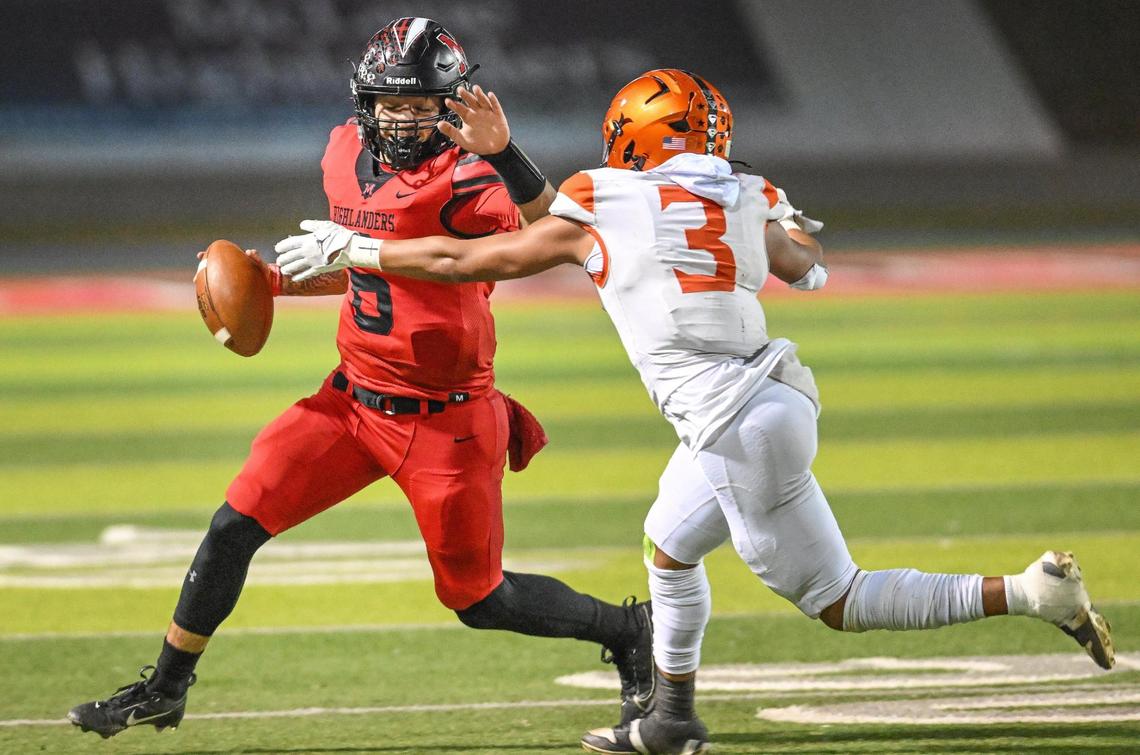 McLane quarterback Noah Zamora tries to get past a Wasco defender in the second half of their Central Section Division IV quarterfinal playoff game at McLane Stadium in Fresno on Friday, Nov. 8, 2024.