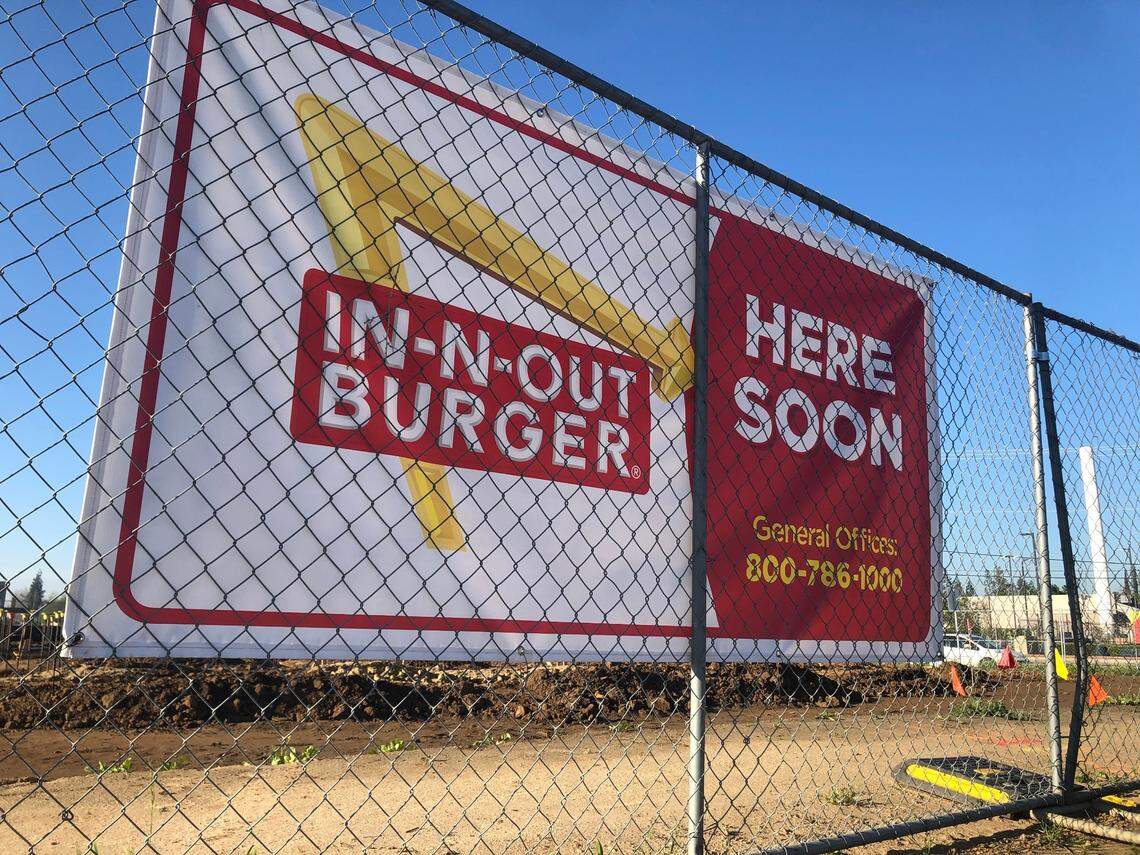 An In-n-Out Burger sign was displayed on a chain-link fence earlier this month in the Fancher Creek Town Center, indicating the structure that’s being built a few hundred yards from what appears to be the front entrance of the upcoming Target. Both Target and In-N-Out project to open around October.