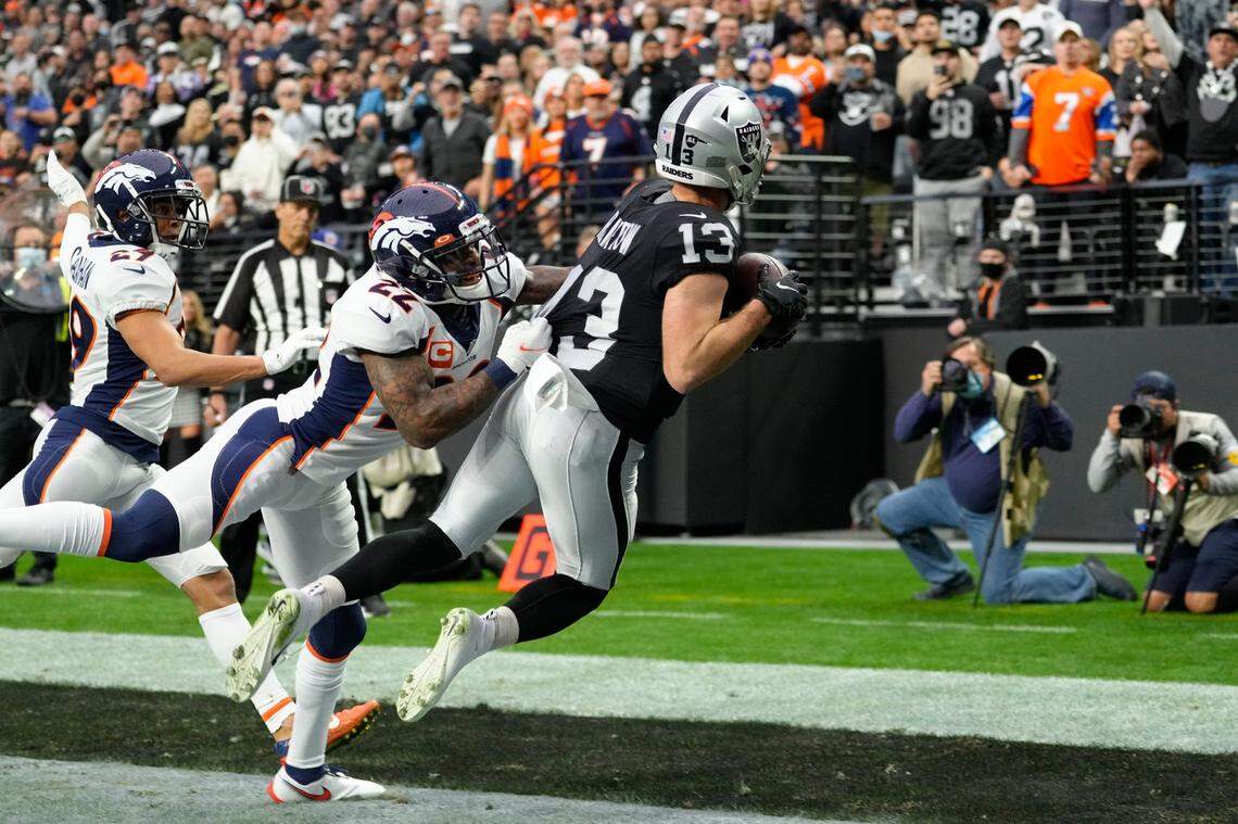Las Vegas Raiders wide receiver Hunter Renfrow catches a touchdown pass during the first half of an NFL game against the Denver Broncos, Sunday, Dec. 26, 2021, in Las Vegas.
