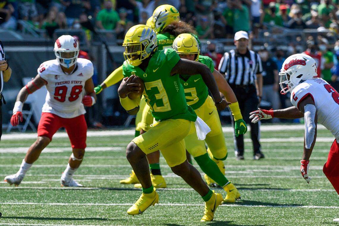Oregon quarterback Anthony Brown weaves through the Fresno State defense on a 30-yard touchdown run in the fourth quarter of the Ducks’ 31-24 victory over the Bulldogs on Saturday, Sept. 4, 2021.