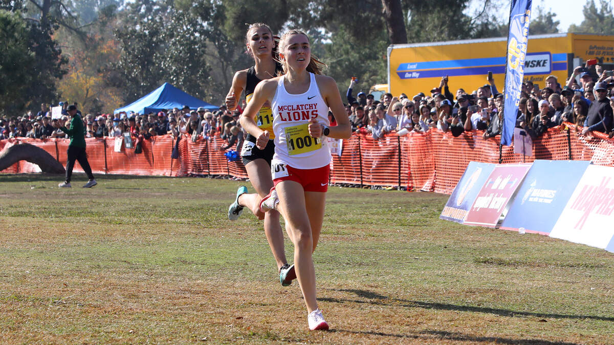 McClatchy High junior Anna McNatt overtook Samantha McDonnell of Newbury Park near the finish to win the girls Division I race in 17:07.5 at Woodward Park on Nov. 27, 2021.