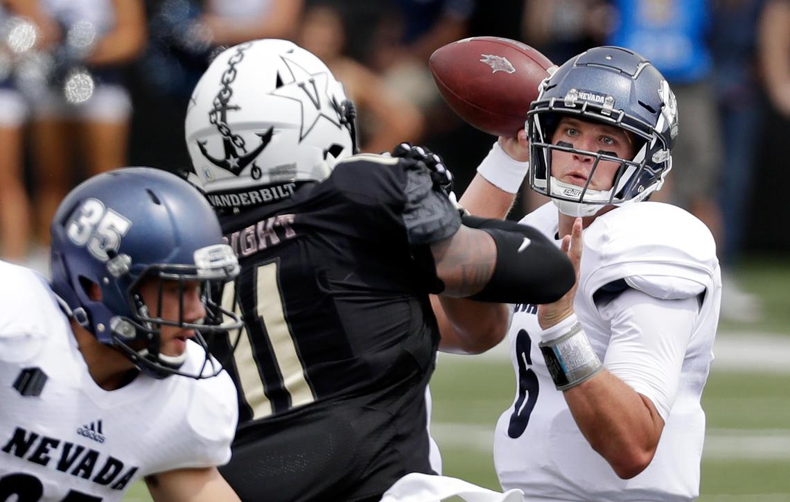 Nevada quarterback Ty Gangi (6) passes as he is pressured by Vanderbilt linebacker Charles Wright (11) in a 41-10 loss to the Commodores Saturday, Sept. 8, 2018, in Nashville, Tenn. Gangi has thrown at least one interception is seven consecutive games.