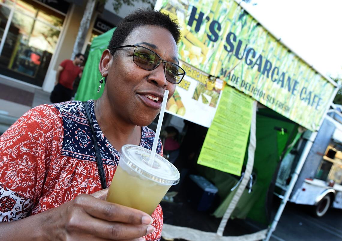 Donna Oldham says the iced sugar cane juice from H’s Sugarcane Cafe  at the River Park Farmers Market brought back childhood memories when she and family members would chew on sugar canes from a neighboring farm.
