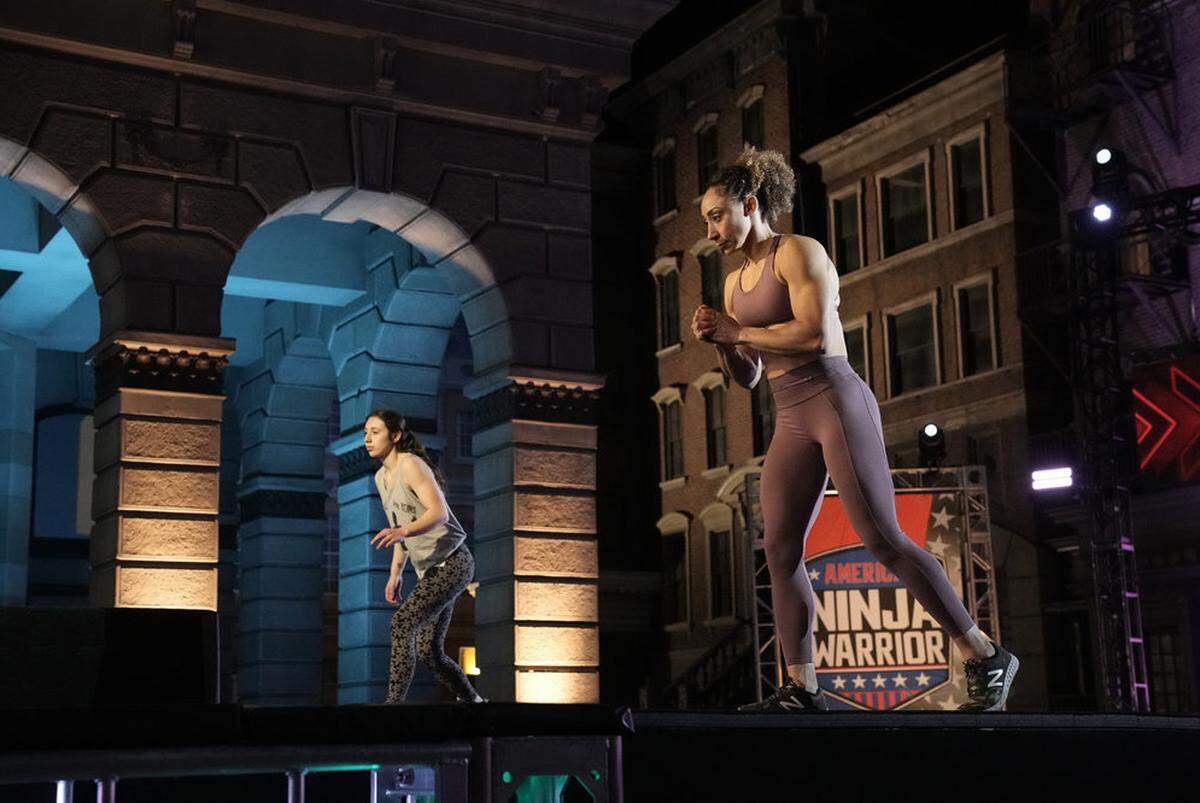 Zhanique Lovett, right, competes in the semifinal round of “American Ninja Warrior.”