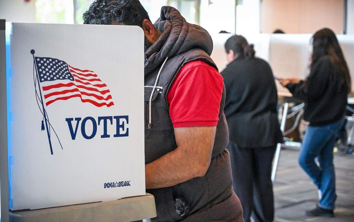 Voters mark their ballots at the Clovis Transit Center, a new permanent polling place that replaces its former location at Clovis City Hall, on Election Day, Tuesday, Nov. 5, 2024.