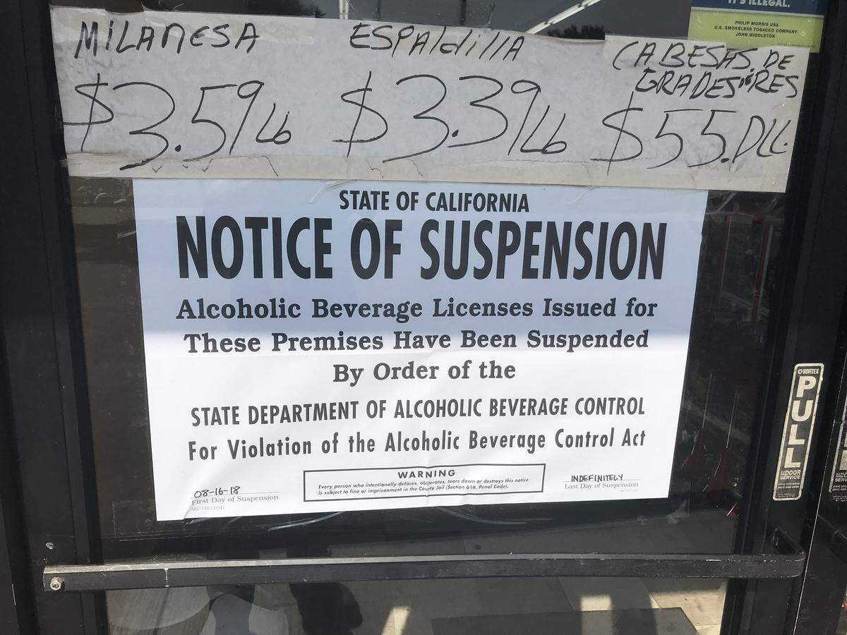 State officials and Fresno police posted an indefinite suspension order on the front of Primo’s Family Market at 2717 N. Hughes Ave. on Thursday, Aug. 16, 2018.