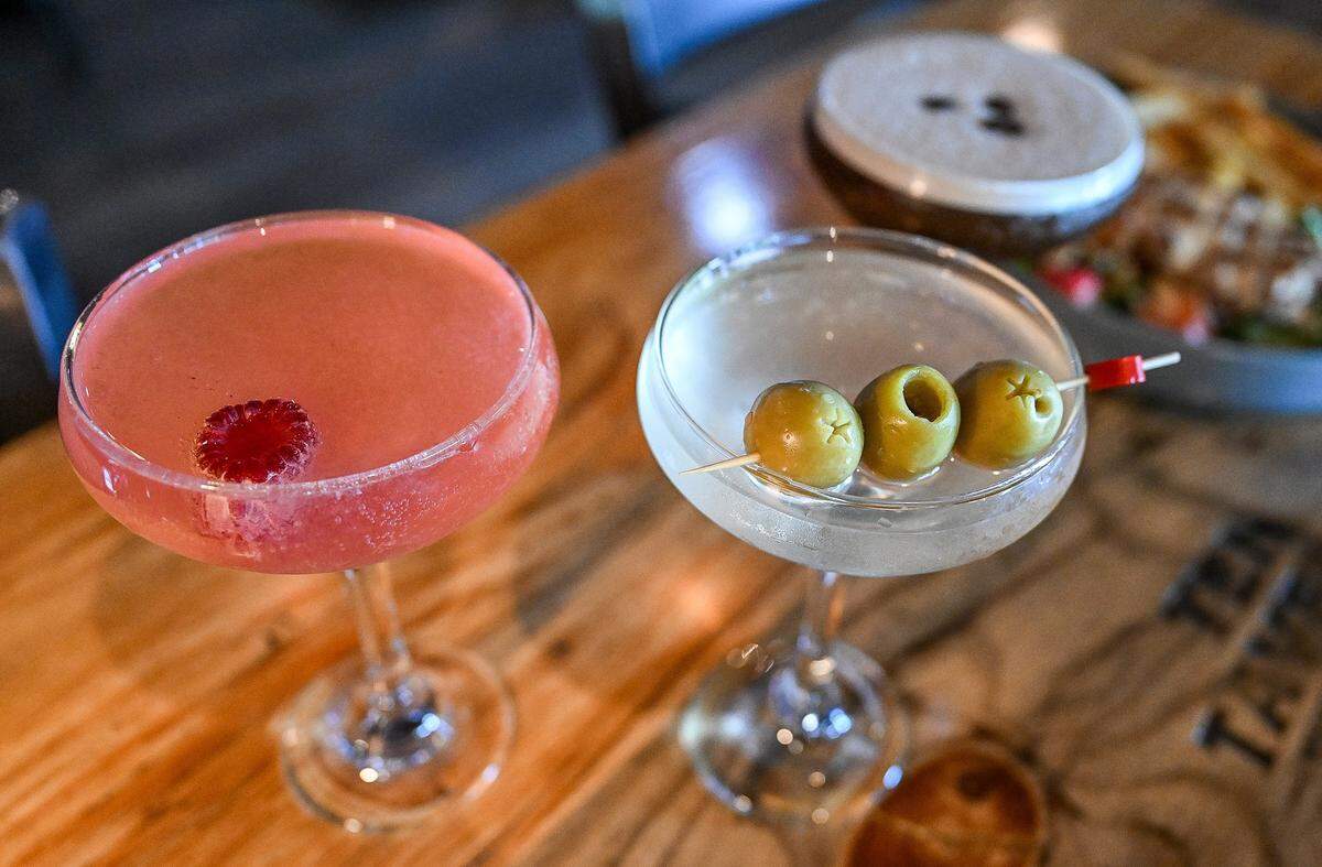 Ten Tavern's “girl dinner” menu item includes a cocktail choice between a “Tentini,” left, made with raspberry and Champagne, a dirty martini, center, or an espresso martini.