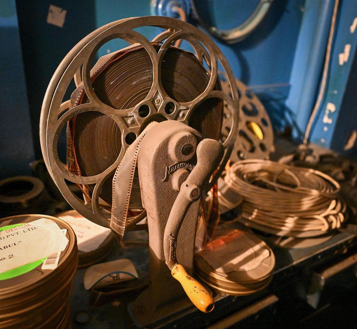 An old film spooling reel with film still in it sits in the projection room at the Historic Crest Theatre on Broadway Plaza in downtown Fresno. Built in 1949, the Art Deco-style theatre is family-owned and hosts musicals, films, concerts as well as other public and private events. Owners are currently raising money through GoFundMe to replace the air conditioning unit that failed during the pandemic.
